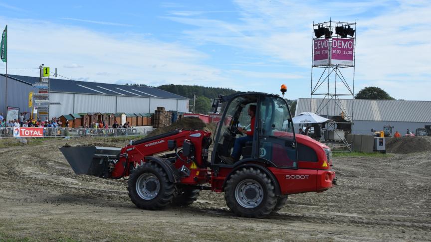 Weidemann 5080 T kniklader met telescopische laadarm.